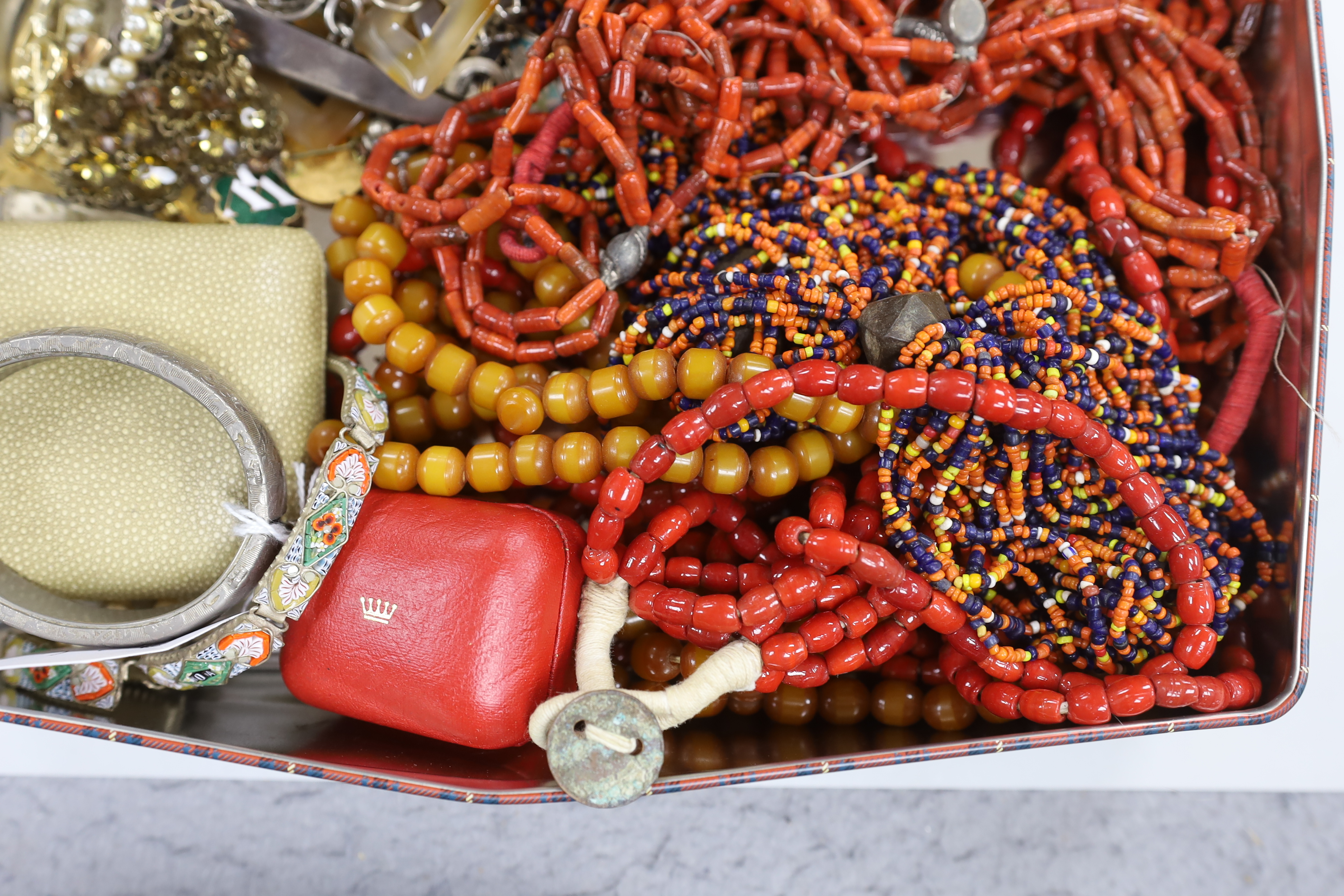 A group of assorted costume jewellery, including an orange zircon? ring.